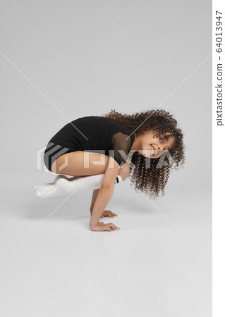 Flexible strong irl standing on arms. Flexible strong irl standing on arms. 64013947