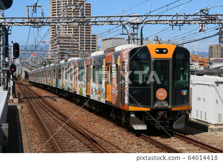 Hanshin 1000 series train passing Otai Station 64014418