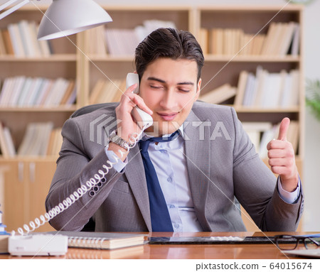 Drug addict businessman in the office 64015674
