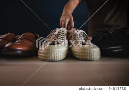 Men Footwear Fashion. Male Picking a Sneaker Shoes Men Footwear Fashion. Male Picking a Sneaker Shoes 64015788
