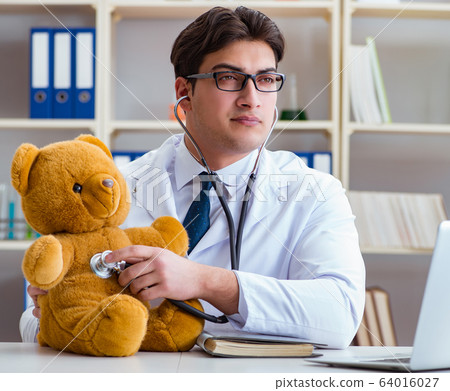 Doctor veterinary pediatrician holding an examination in the off Doctor veterinary pediatrician holding an examination in the off 64016027