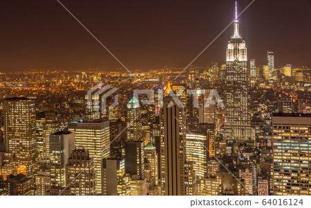 Night view of New York Manhattan during sunset 64016124