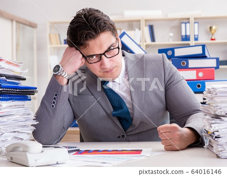Businessman busy with much paperwork Businessman busy with much paperwork 64016146