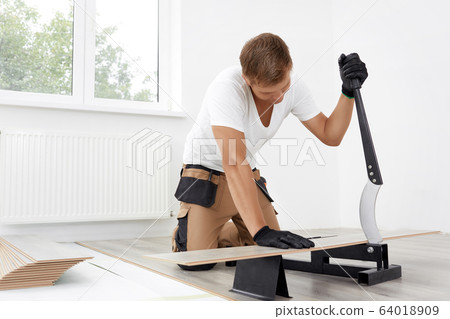 Cutting laminate with a manual cutter. 64018909