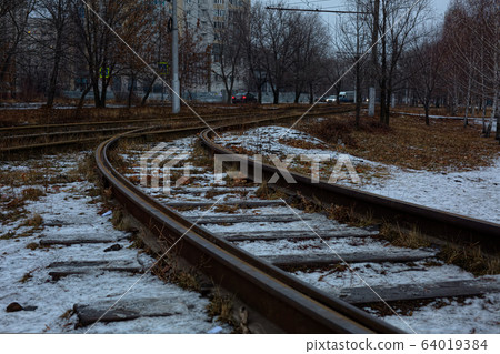 A railroad track sleeper on the outskirts of the city. A railroad track sleeper on the outskirts of the city. 64019384