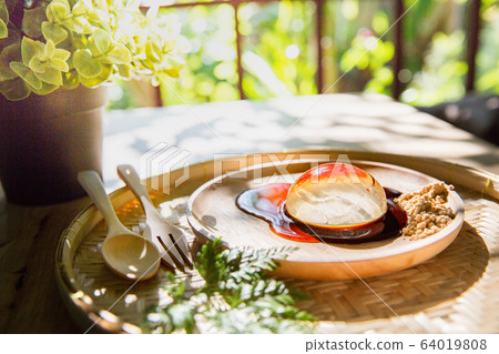 Japanese water drop mochi with wooden spoon , Asia dessert Japanese water drop mochi with wooden spoon , Asia dessert 64019808