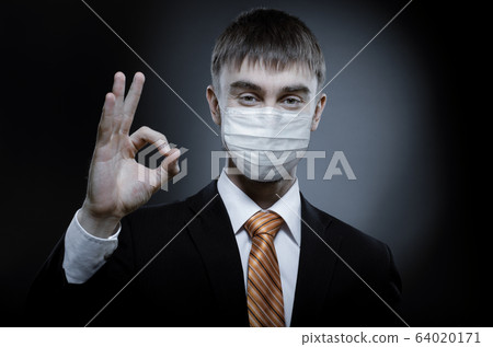 man in medical mask on face man in medical mask on face 64020171