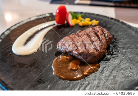 Delicious medium rare wagyu beef  steak with gravy sauce Delicious medium rare wagyu beef  steak with gravy sauce 64020699