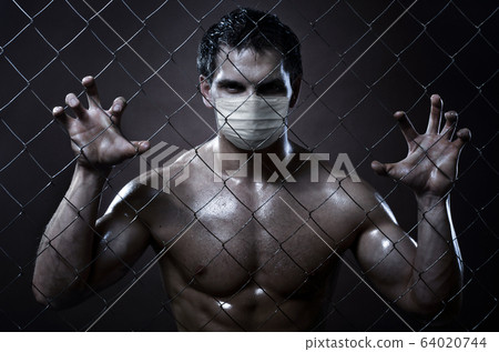 man covid-19 coronavirus in medical mask 64020744