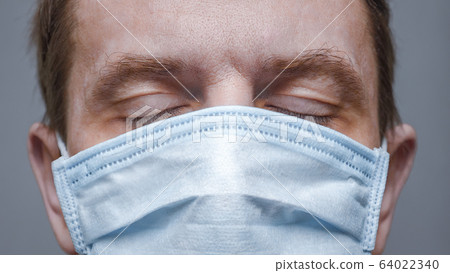 Coronavirus disease, male face. COVID-19. Critical time: pandemic. Social distancing background. nCov panic. Accurate health information. Health Alert background. Vital information about COVID-19. Coronavirus disease, male face. COVID-19. Critical time: pandemic. Social distancing background. nCov panic. Accurate health information. Health Alert background. Vital information about COVID-19. 64022340
