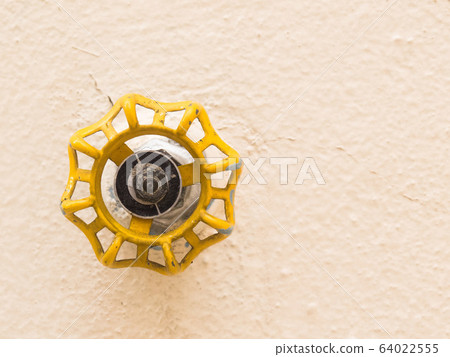 Yellow faucet front view isolated on soft backlight. Yellow faucet front view isolated on soft backlight. 64022555