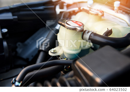coolant car engine detail - close up of machine coolant car engine detail - close up of machine 64023502
