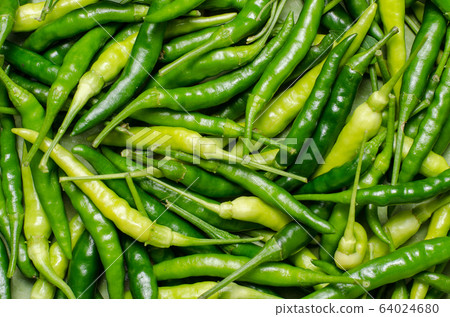 Close up top view of unripe green chilli Close up top view of unripe green chilli 64024680