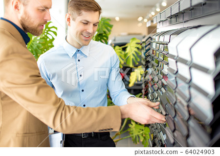 handsome customer choosing color of car design handsome customer choosing color of car design 64024903