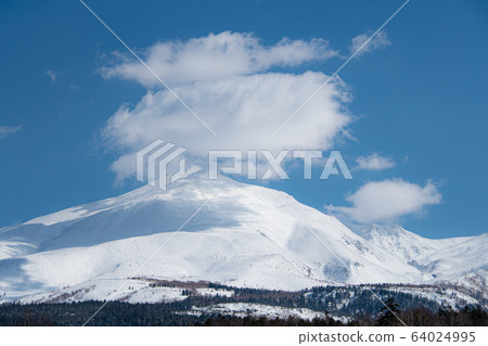 Clouds and snowy mountains in early spring Clouds and snowy mountains in early spring 64024995