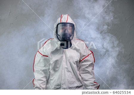 portrait of unrecognizable disinfector in gas-mask 64025534