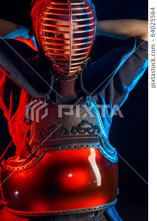 young female kendo fighter wearing mask young female kendo fighter wearing mask 64025564