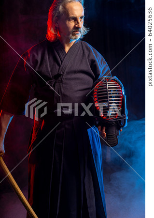 confident kendo warrior in traditional outfit confident kendo warrior in traditional outfit 64025636