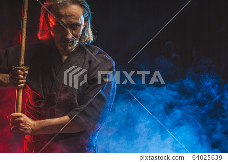 portrait of male kendo fighter with bokuto. protection concept portrait of male kendo fighter with bokuto. protection concept 64025639