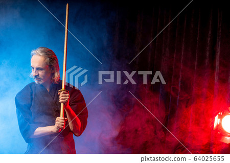 portrait of kendo fighter with bokuto. traditional japanese martial art of sword fighting 64025655
