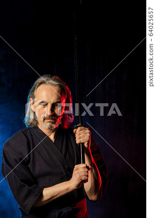 caucasian kendo fighter in traditional clothes 64025657