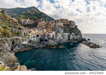 Italian coastline and colorful Manarola village in Cinque Terre, Italy 64025668
