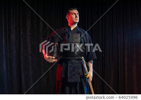 portrait of kendo fighter with bokuto. traditional japanese martial art of sword fighting 64025996