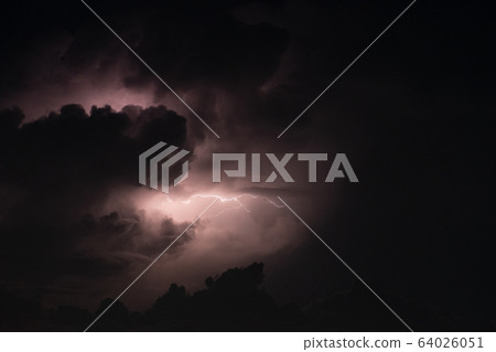 Lightning bolt in the rainstorm and big cloud at night. thunder bolt feel dangerous. 64026051