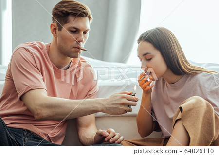 couple catch a buzz from using cannabis, marijuana couple catch a buzz from using cannabis, marijuana 64026110