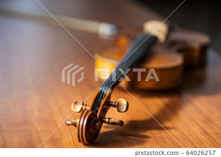 musical instrument violin on table, music concept 64026257