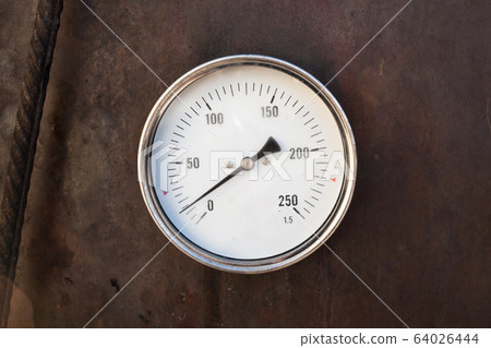 Axial thermometer mounted in rusty steel stove 64026444