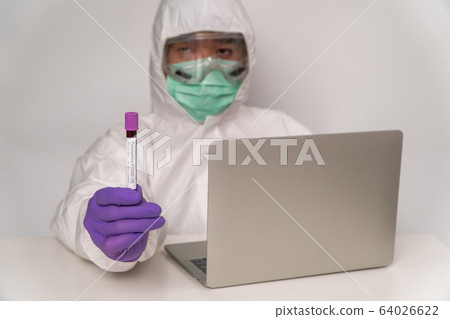 Doctors in the protective suits and masks are Doctors in the protective suits and masks are 64026622