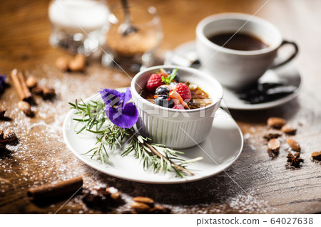 Avocado creme brulee served in a cup in restaurant Avocado creme brulee served in a cup in restaurant 64027638