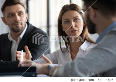 Attractive manager businesswoman conducts coaching in boardroom. 64028306