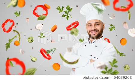 Healthy nutrition. Professional head chef and flying vegetables on grey background, collage. Blank space 64029268