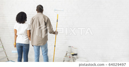 African american family paints walls without repairman African american family paints walls without repairman 64029497