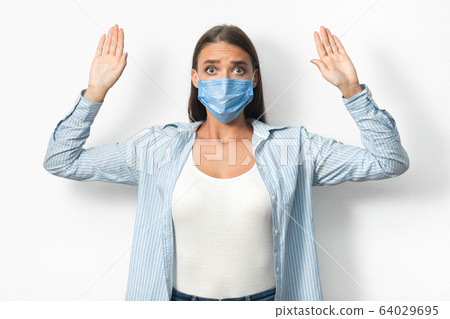 Woman In Mask Raising Hands Breaking Self-Quarantine Rules, White Background 64029695