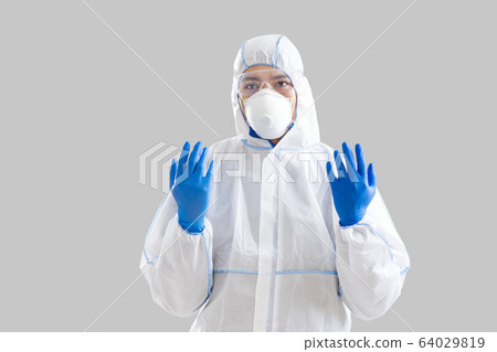 Disinfection amid coronavirus epidemic. Man in protective suit 64029819