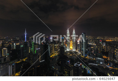 Aerial view of Kuala Lumpur city center skyline at night Aerial view of Kuala Lumpur city center skyline at night 64029847