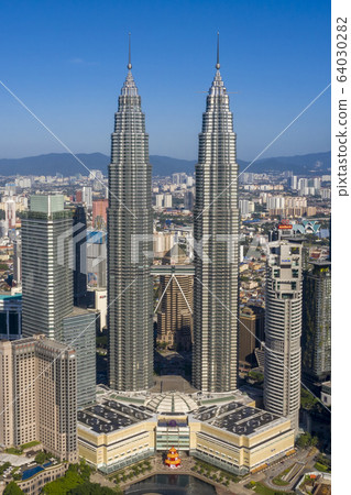 Kuala Lumpur skyline cityscape with blue sky Kuala Lumpur skyline cityscape with blue sky 64030282