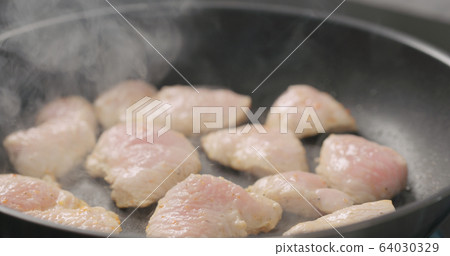 turkey fillet pieces frying on nonstick pan turkey fillet pieces frying on nonstick pan 64030329