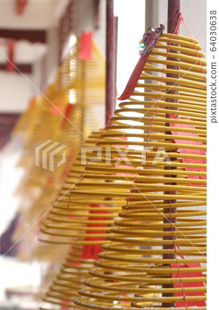 Ring incense hanging in a temple Ring incense hanging in a temple 64030638