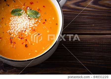 Pumpkin soup on the table Pumpkin soup on the table 64031220