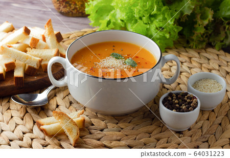 Pumpkin soup on the table Pumpkin soup on the table 64031223
