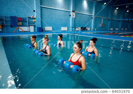 Female swimmers group, aqua aerobics in the pool Female swimmers group, aqua aerobics in the pool 64031970