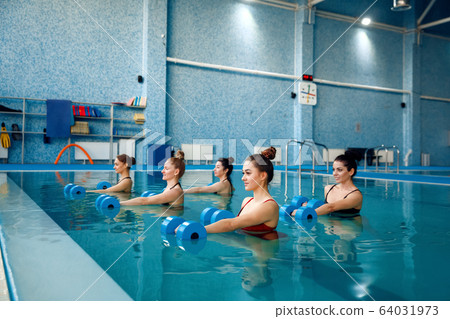 Female swimmers group, aqua aerobics in the pool 64031973