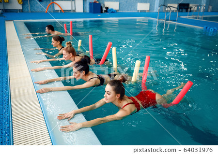 Female swimmers group, aqua aerobics training 64031976