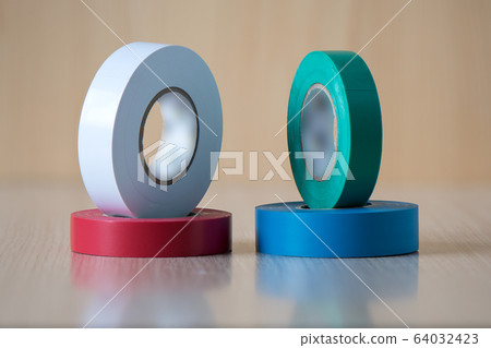 Four colorful insulating tapes to insulate twisted of electrical wires. Four colorful insulating tapes to insulate twisted of electrical wires. 64032423