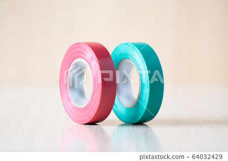 Red and green insulating tapes to insulate twisted of electrical wires. Red and green insulating tapes to insulate twisted of electrical wires. 64032429