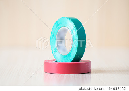Red and green insulating tapes to insulate twisted of electrical wires. Red and green insulating tapes to insulate twisted of electrical wires. 64032432